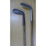 Two hickory shafted golf clubs,