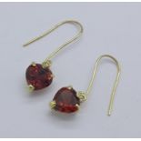 A pair of 9ct gold and garnet earrings