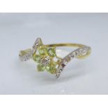 A 9ct gold, peridot and diamond ring, 1.