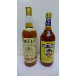A bottle of Bell's Old Scotch Whisky 26 2/3 ozs and a bottle of Wood's Old Charlie Jamaica Rum 26