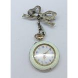 A lady's silver and enamel fob watch with decorative case and silver bow brooch,
