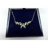 A diamond necklace set in 18ct white gold marked 750