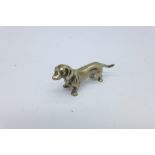 An 800 cast silver dog miniature