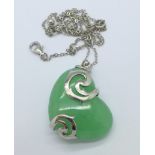 A silver and jade pendant and chain