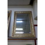 A gilt framed mirror