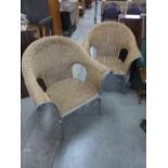 A pair of wicker armchairs