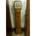 An Art Deco oak dwarf longcase clock