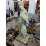 A reproduction garden figure of a lady