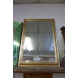 A gilt framed mirror