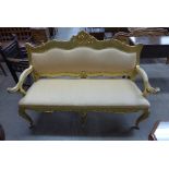 A French Louis XV style carved gilt wood upholstered settee