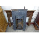 An Art Nouveau Cast iron fire surround and two Victorian cast iron fire surrounds