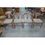 A set of four Danish teak dining chairs