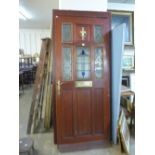 A hardwood and stained glass door