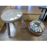 An elm milking stool and mahogany footstool