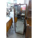 A pair of teak mirrors