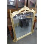 A reproduction French Louis XV style gilt mirror