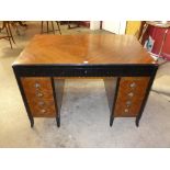 An Art Deco inlaid mahogany and ebonised kneehole desk