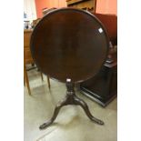 A George III mahogany circular tilt top tripod table