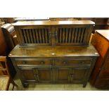 an Ercol court cupboard