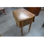 A Victorian mahogany drop-leaf sewing table
