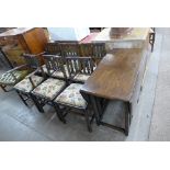 An oak gateleg table and six chairs
