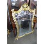 A reproduction French Louis XV style gilt mirror