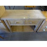 A pine two drawer sideboard