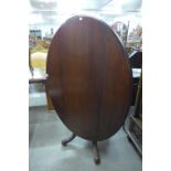 A Victorian mahogany oval tilt top breakfast table