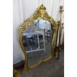 A reproduction French Louis XV style gilt mirror