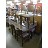 An oak draw-leaf table and six chairs