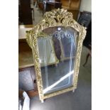 A reproduction French Louis XV style gilt mirror