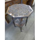 A Victorian carved oak octagonal occasional table