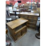 A pine chest of drawers and TV unit