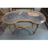 A Victorian inlaid walnut kidney shaped writing table
