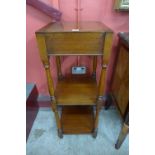 A Victorian mahogany adjustable top three tier whatnot