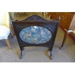 An Edward VII oak and embroidered firescreen