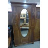 An Edward VII inlaid mahogany wardrobe