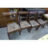 A set of four George III provincial oak rush seated dining chairs