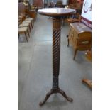 A Hepplewhite style mahogany torchere