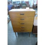 A teak chest of drawers