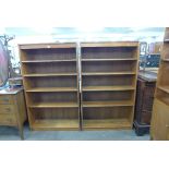 A pair of teak open bookcases