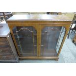 A walnut display cabinet