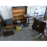 An open bookcase, child's chair, sewing machine, enlarger, etc.