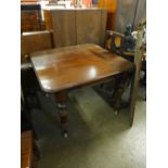 A Victorian mahogany extending dining table