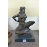 A bronze figure of an erotic female,