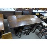 Am oak refectory table and four oak and leather upholstered chairs