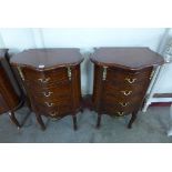 A pair of reproduction French Louis XV style rosewood and walnut effect chests