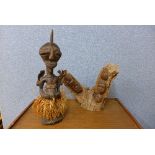 An African carved wood fertility figure and another carving