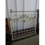 A Victorian wrought iron and brass double bed
