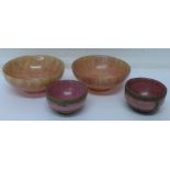 Four South East Asian turned stone bowls,